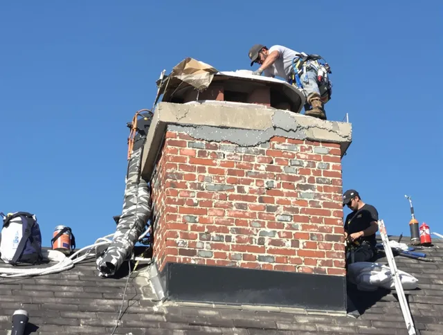 Manchester Chimney Sweep installing a custom chimney crown in Manchester, CT