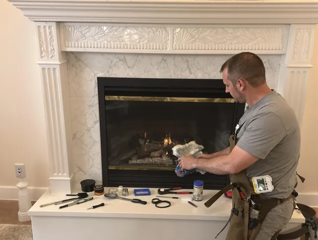 Manchester Chimney Sweep performing fireplace maintenance in Manchester, CT