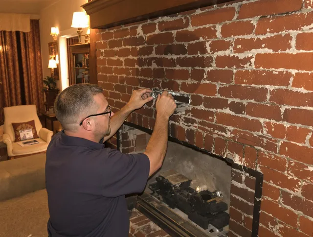Manchester Chimney Sweep expert fixing a fireplace in Manchester, CT